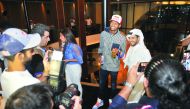 Qatar’s world champion in high jump Mutaz Essa Barshim interacts with fans during the Red Bull event in Doha.
