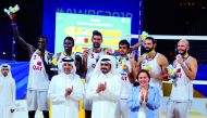 President of Qatar Olympic Committee, H E Sheikh Joaan bin Hamad Al Thani posing for a photograph with the Qatar 4x4 beach volleyball team after they won the silver medal on the final day of the ANOC World Beach Games at Katara beach, yesterday. Picture: 