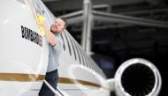 Bombardier employee Francis Masse polishes the sign of Bombardier's Global 7500, the first business jet to have a queen-sized bed and hot shower, is shown during a media tour in Montreal, Quebec, Canada, December 19, 2018. Reuters/Christinne Muschi 