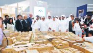 H E Ali bin Ahmed Al Kuwari, Minister of Commerce and Industry, and other dignitaries visiting the Msheireb Properties pavilion at the Cityscape Qatar 2019, yesterday.  
