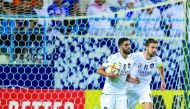 Al Sadd’s Hassan Al Haydos (left) celebrates with captain Gabi Fernández after scoring their third goal against Al Hilal, yesterday. 