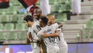 Al Rayyan’s Yacine Brahimi (right) celebrates with team-mates after scoring their second goal against Al Sailiya at the Al Ahli Stadium, yesterday.