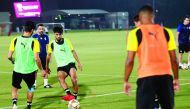 Al Sadd players train under the supervision of coach Xavi.