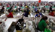 Employees work at a factory supplier of the H&M brand in Kandal province, Cambodia, December 12, 2018. Reuters/Samrang Pring