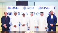 The officials of QNB and Porsche Centre Doha, during the signing ceremony.