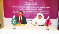 H E Ali bin Ahmed Al Kuwari (right), Minister of Commerce and Industry, and Omar Ayub Khan, Pakistan’s Federal Minister for Power, Petroleum and Natural Resources, signing a document on the sidelines  the fifth session of the Qatari-Pakistani Joint Minist