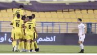 Qatar SC players celebrate after winning their QNB Qatar Stars League match against defending champions Al Sadd at Al Gharafa Stadium. Qatar SC won 3-0; Action from the same match.
