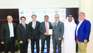 QIB officials posing for a group picture after receiving the award.