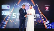 Jamal Abdullah Al Jamal (right), QIIB Deputy CEO, receiving the award.