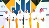 Minister of Commerce and Industry H E Ali bin Ahmed Al Kuwari (third left) and QDB CEO Abdulaziz bin Nasser Al Khalifa (third right) with the winners.