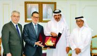 Qatar Chamber First Vice-Chairman, Mohamed bin Ahmed bin Towar Al Kuwari (second right), presenting a memento to Venezuela’s Minister of Tourism & Foreign Trade, Felix Ramon Gonzalez, at QC headquarters, in Doha yesterday. 