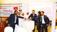 Senior officials cutting a cake to celebrate the unveiling of Gulf Exchange’s Turkish website.