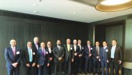 Rashid Al Mansoori (sixth left), CEO of Qatar Stock Exchange; top Qatari bankers and fund managers; and other officials on the sidelines of the forum in London.