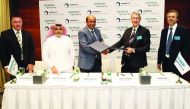 Alekh Grewal (third left), Group CEO & Director, Mannai Corporation, and Adrian Wood, CEO, Siemens Qatar, exchanging signed contracts during a press event held at Hotel InterContinental The City. Pic: Qassim Rahmatullah/the peninsula