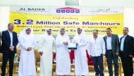 Senior officials of Barwa Real Estate Group and Al Bader Construction and Steel Works pose for a group picture after marking the safety accomplishment. 