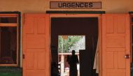 A Central African internally displaced woman holds a child inside an emergency room of the MSF-run hospital in Bangassou on May 26, 2017. AFP / Saber Jendoubi