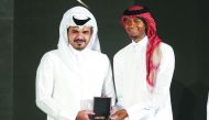 Qatar Olympic Committee President H E Sheikh Joaan bin Hamad Al Thani presenting the Male Player of the Year Award to high jump world champion Mutaz Essa Barshim during the annual Sports Excellence Awards held in Doha yesterday. Pictures: Mohamed Farag