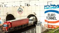 In this file photo taken on October 20, 2015 trucks arrive through a new Eurotunnel freight tunnel created to increase cross-English Channel trading in Coquelles. AFP / Philippe Huguen