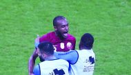 Qatar’s Abdelkarim Hassan with team-mates.