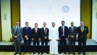 Hussein M Al Abdullah (fourth right), QSE Marketing and Communication Director with FTSE Russell CEO Waqas Samad (third right) and senior market experts and officials on the sidelines of  the seminar  in Doha, Monday.