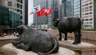 The Hong Kong Exchanges flag, Chinese national flag and Hong Kong flag are hoisted outside the Hong Kong Stocks Exchange, June 7, 2016. Reuters / Bobby Yip