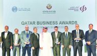 Yousuf Mohamed Al Jaida (centre), CEO, QFC; and Joseph Abraham (fourth left), Group CEO, Commercial Bank, with Haithem Katerji (fourth right), Chief Investment Officer, Al Rayan Investment;  Akber Khan (third right), Senior Director-Asset Management, Al R