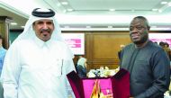 Mohamed bin Ahmed bin Towar Al Kuwari (left), Qatar Chamber’s First Vice-Chairman, presenting a memento to the visiting Ghanaian Minister of Business Development, H E Dr Ibrahim Mohammed Awal, yesterday.