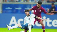 Argentina’s Lionel Messi (left) and Qatar’s Tarek Salman in action during their Copa America Group B match played at the Gremio Arena in Porto Alegre, Brazil, in this June 23 file photo.