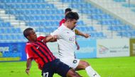 Al Sadd’s Baghdad Bounedjah (right) vies for the ball against an Al Rayyan player during their 2019 Ooredoo Cup Group A match played the Saud bin Abdul Rahman Stadium yesterday