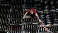 Employees work on bitcoin mining computers at Bitminer Factory in Florence, Italy, April 6, 2018. Picture taken April 6, 2018. Reuters/Alessandro Bianchi