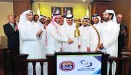 Moutaz Al Khayyat (fourth right), Group Chairman of Baladna; along with the Board Members ringing the bell marking the opening of QSE market on the occasion of Baladna’s listing on the bourse yesterday, as QSE CEO Rashid bin Ali Al Mansoori (right) and ot