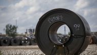 In this file photo taken on June 4, 2018 steel coils lay in a yard at ArcelorMittal Dofasco steel plant in Hamilton, Canada. AFP / Getty Images North America / Cole Burston