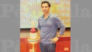 Salman Butt poses with the Qatar National Day T20 Clash trophy which will be presented to the winners. Butt is set to lead the International XI which will take on Qatar’s national team in a one-off clash at Asian Town Cricket Stadium tomorrow. 