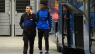 Barcelona's Spanish coach Ernesto Valverde (L) and Barcelona's Guinea-Bissau forward Ansu Fati leave the Camp Nou Stadium in Barcelona on December 18, 2019, ahead of the Spanish League football match between Barcelona FC and Real Madrid CF. (AFP / LLUIS G