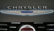 This combination of file pictures shows a Chrysler logo and a logo of Fiat. (AFP / Mandel Ngan and Marco Bertorello)