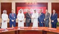 QIIB Deputy CEO Jamal Abdullah Al Jamal  receiving the honour at the event held at QIIB headquarters.