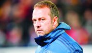 Munich's German head coach Hansi Flick waits for an interview before the German first division Bundesliga football match SC Freiburg v Bayern Munich, on December 18, 2019 in Freiburg. AFP / Thomas Kienzle