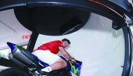 Swiss Stan Wawrinka rides a motorbike on the Motion Sphere Platform during his visit to the ExxonMobil Stand.