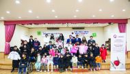 The officials and children during the winter-focused campaign in Seoul, South Korea.

