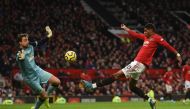 Manchester United's English striker Marcus Rashford (R) puts the ball past Norwich City's Dutch goalkeeper Tim Krul (L) to score the opening goal during the English Premier League football match between Manchester United and Norwich City at Old Trafford i