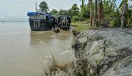 This picture taken on September 17, 2019 shows soil erosion caused by the waters of Brahmaputra river at Majuli island in the northeastern Indian state of Assam. AFP / Diptendu Dutta