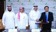 Fahad Hamad Al Mohannadi (second right), Chairman of the Board of Nebras; Khalid Mohammed Jolo (second left), Chief Executive Officer of Nebras; and other officials during the signing ceremony.
