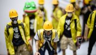 This picture taken on January 14, 2020, shows 1:6 scale action figures depicting characters involved in the Hong Kong protests, in Hong Kong. AFP / Philip Fong 