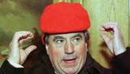 Terry Jones, one of the original Monty Python British comedy troupe members, tries to adjust a winter hat that is just a little bit too small for his head. Reuters file photo / Gary Caskey 