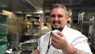 Canadian vegan chef Doug McNish poses in a hotel kitchen in Davos, Switzerland, where he is preparing a meal for the World Economic Forum annual meeting on on January 21, 2020. Thomson Reuters Foundation/Belinda Goldsmith