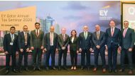 Experts posing for a group picture on the sidelines of  the EY Qatar Annual Tax Seminar.