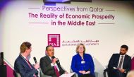 H E Ali bin Ahmed Al Kuwari (second left), Minister of Commerce and Industry,; Hassan Al Thawadi (right), Secretary-General of the Supreme Committee for Delivery and Legacy, and others speaking at the high-level panel discussion organised by the Qatar Inv
