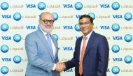 QIB’s Personal Banking Group General Manager, D. Anand (right) and  Marcello Baricordi, Visa’s General Manager for Middle East and North Africa, shaking hands after announcing the partnership.