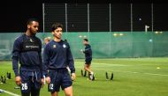 Al Gharafa striker Jonathan Kodjia (left) with his team-mate during a team's training session. 
