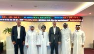 Yousuf Mohamed Al Jaida (second left), Sadiq Hamour (second right), Daniel Sandmeier (third  right) with members of the QFC and Instimatch management.